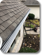 Grandview installing bronze gutter guard protection on a customer's house.